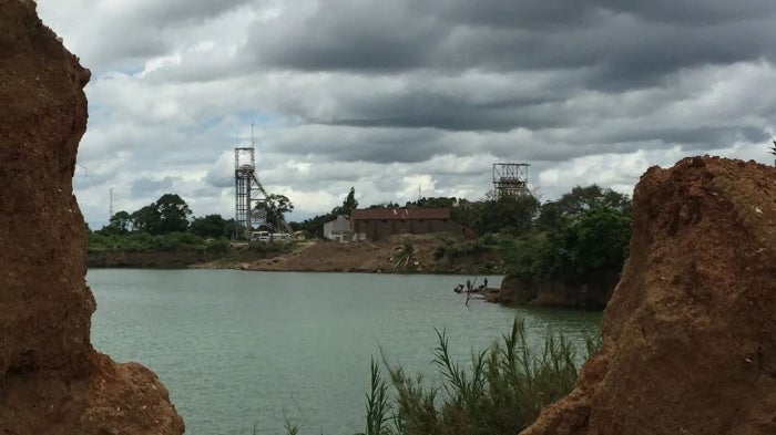 View of a former mine pit, now flooded, at the old mine site in Kabwe.