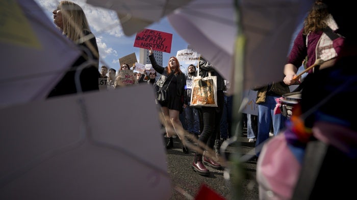 Women take part in a rally dubbed "Our Uterus is not your profit" to raise awareness on the difficulties of getting an abortion in a state hospital, during International Women's Day outside the government headquarters in Bucharest, Romania, March 8, 2023.