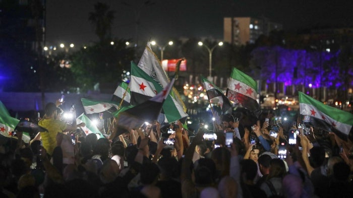 Syrians celebrate in Umayyad Square after U.S. President Donald Trump announced plans to ease sanctions on Syria in Damascus, Syria, Tuesday, May 13, 2025.