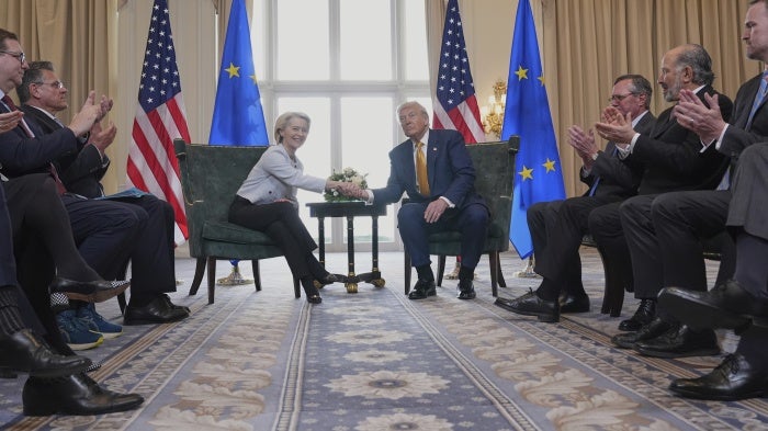 European Commission President Ursula von der Leyen (L) and US President Donald Trump shake hands after reaching a trade deal in Turnberry, Scotland, July 27, 2025. 