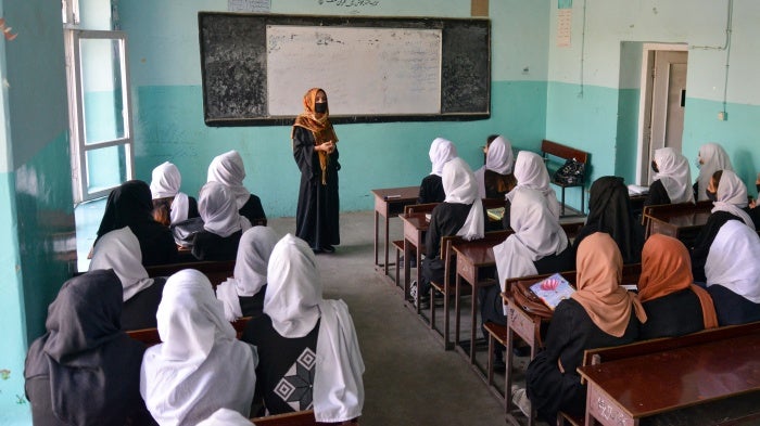 Afghan girls attend a class after their school reopened in Kabul on March 23, 2022. Hours later, the Taliban ordered girls' secondary schools shut.