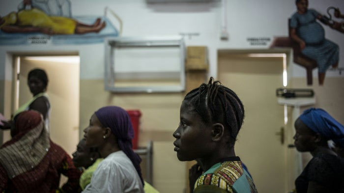 Pregnant women sit in the waiting area at the pre-natal clinic of the Princess Christian Maternity Hospital