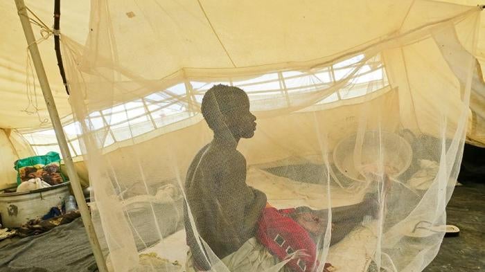 Nyanial, 22, nurses one of her three children in the UNMISS camp near Bentiu in June. Soldiers and militia attacked her town in Koch county in May 2015. 