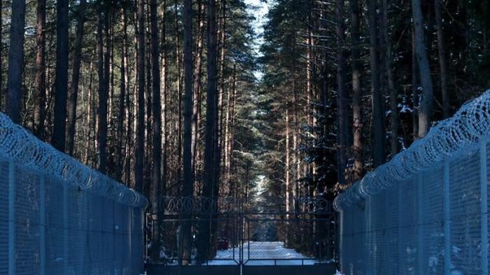 Barbed wire fence surrounding a military area