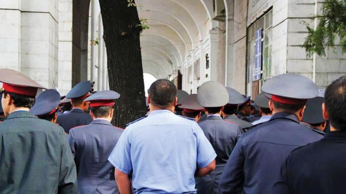 Kyrgyzstan police standing near Ala-Too square.