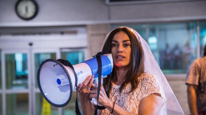 Sonia Ossorio of NOW-NYC addresses the crowd at a protest against US laws allowing child marriage.