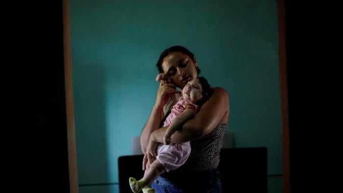 Raquel, 25, holds her daughter Heloisa in Areia, Paraíba state, Brazil. Raquel gave birth to twin daughters with Zika syndrome in April 2016. “I want to give my best to my daughters,” she said in an interview with Human Rights Watch.