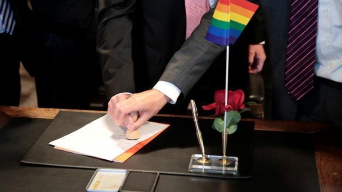 Same-sex couple get married at a registry office in Germany.