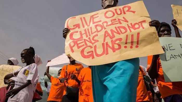 Women from more than forty South Sudanese womens organizations carry placards during march through the city to express the frustration and suffering that women and children face in Juba, South Sudan on December 9, 2017.  