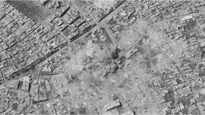 Satellite image of a large blast cloud from the demolition of a residential apartment building with high explosives. Blast cloud consistent with the detonation of a large conventional bomb