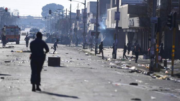 Stones and bricks are seen on a street on the outskirts of Johannesburg, Monday Sept. 2, 2019. Police had earlier fired rubber bullets as they struggled to stop looters who targeted businesses as unrest broke out in several spots in and around the city. 