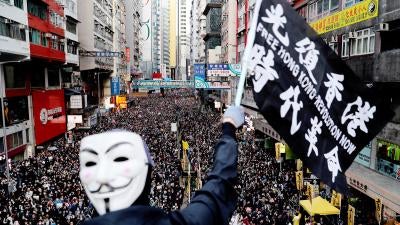 The slogan in Chinese on the flag, “Liberate Hong Kong, the Revolution of Our Times,” was a common chant during the 2019 protests. But since the imposition of the National Security Law, Hong Kong authorities have prohibited both the chant and pro-democracy protests have been prohibited in Hong Kong. The group that has long organized peaceful marches, Civil Human Rights Front, is also no longer functioning and its convenor has been in custody since.