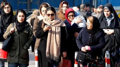 Iranian women walk down a street in the capital Tehran on February 7, 2018.