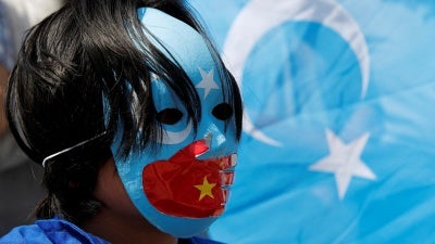 Uyghur demonstrators protest the visit of Chinese Foreign Minister Wang Yi near the Chinese consulate in Istanbul, Turkey, July 26, 2023.