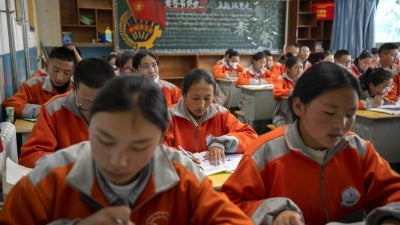 High school students attend a Chinese language class at a public boarding school for students from northern Tibet, in Lhasa in China's Tibet Autonomous Region, June 1, 2021.