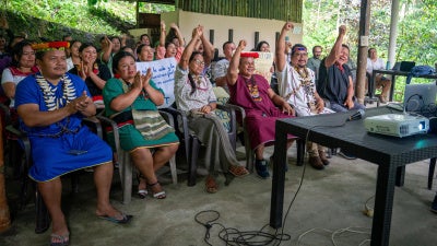 Members of Alianza Ceibo, belonging to the Siekopai, A’i Cofán, Siona, and Waorani Indigenous communities, attend a virtual hearing where a decision was made to unfreeze their organization’s funds. 