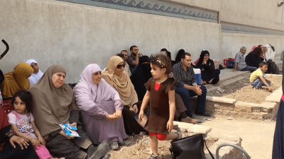 Picture of families protesting outside of Scorpion prison in Egypt.