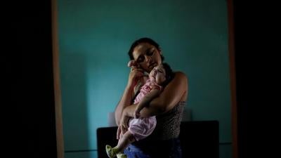 Raquel, 25, holds her daughter Heloisa in Areia, Paraíba state, Brazil. Raquel gave birth to twin daughters with Zika syndrome in April 2016. “I want to give my best to my daughters,” she said in an interview with Human Rights Watch.