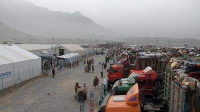 Trucks hired by Afghan refugees forced out of Pakistan and packed with their belongings line up at the UN refugee agency’s support center outside Kabul, October 2016.  