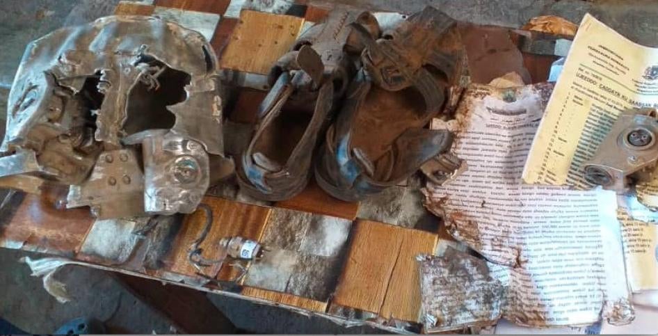 Relatives of the six people known killed in the March 10, 2020 US airstrike on a minibus near the village of Ugunji in Lower Shabelle, Somalia, collected the few objects and possessions they could find during a visit to the site soon after the attack. © 2020 Private  