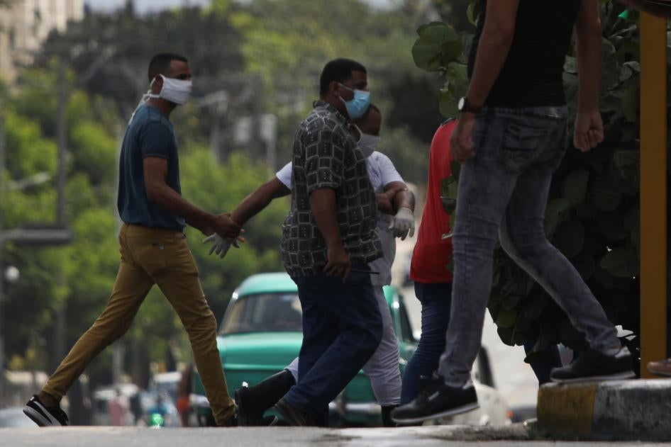 A man is detained at the site where a protest against the killing of a Black man by police was due to take place in Havana, Cuba, June 30, 2020.
