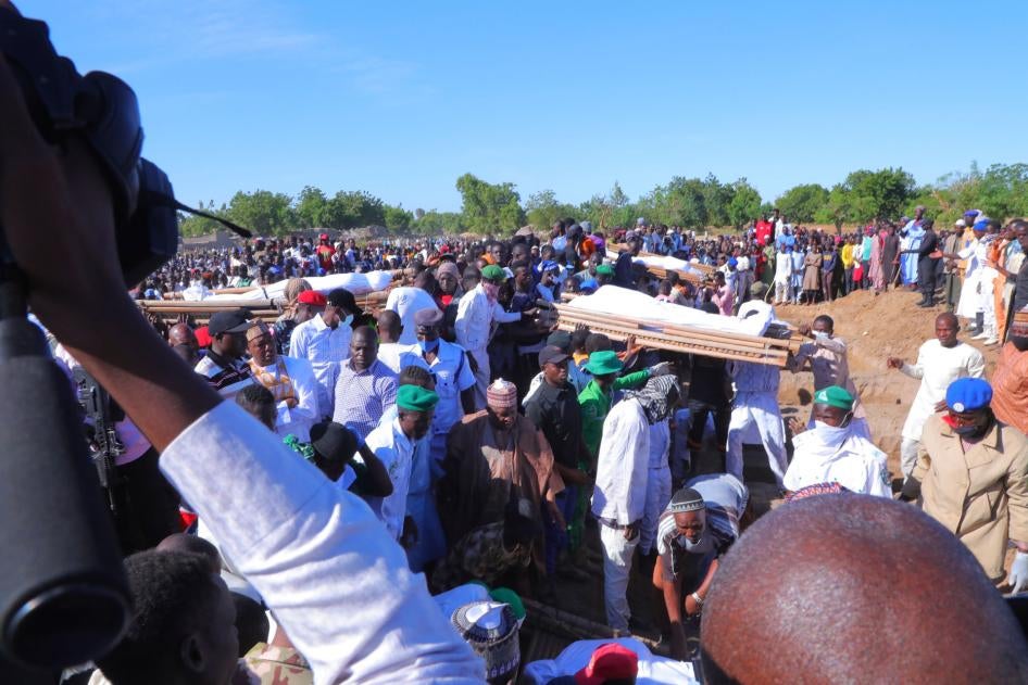 People attend a funeral for people killed by suspected Boko Haram in Zaabarmar, Borno, Nigeria, November 29, 2020. 