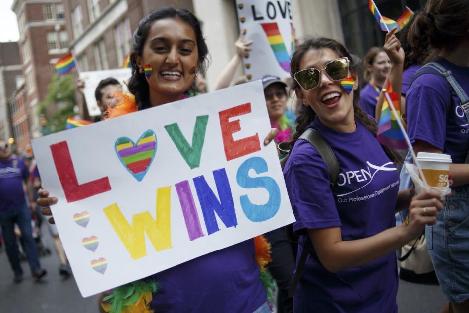 Revelers participate in the Philadelphia LGBT Pride Parade through the city's "Gayborhood" and downtown historic district in Philadelphia, Pennsylvania on June 10, 2018. 