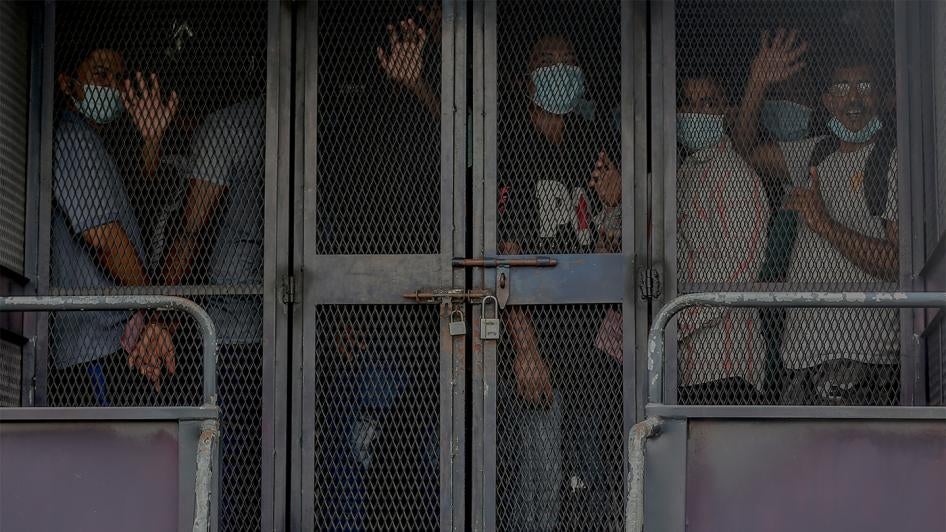 Undocumented migrants are detained during a crackdown by the Immigration Department in response to the Covid-19 pandemic, Petaling Jaya, Malaysia, May 20, 2020.