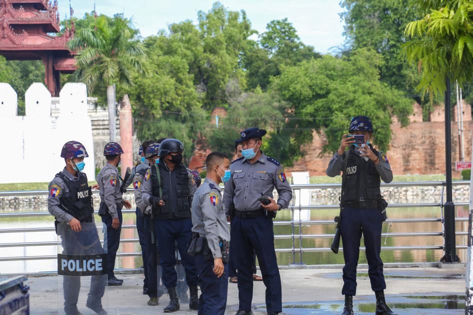 Police officers wearing facemasks stand on a street in Yangon, Myanmar, November 3, 2020. 