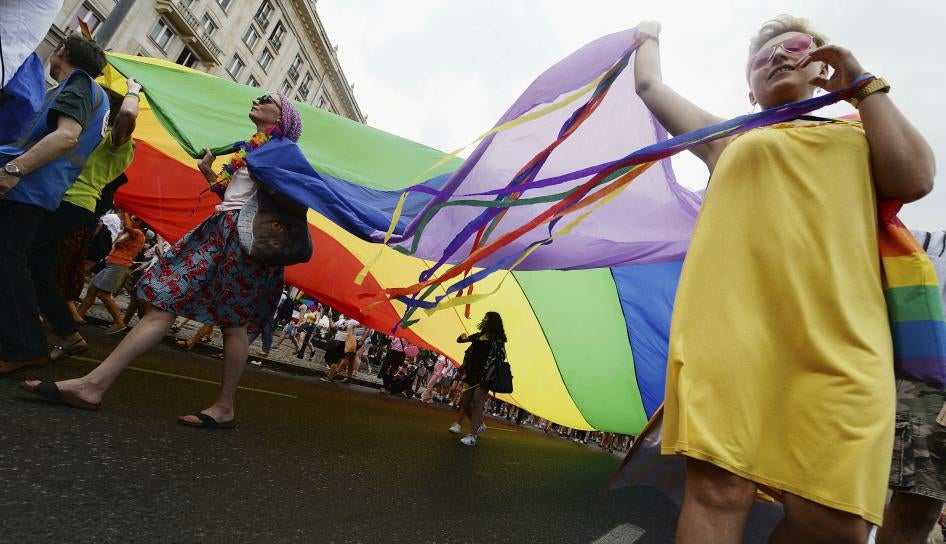 People take part in a gay pride parade in Warsaw, Poland, Saturday, June 8, 2019.