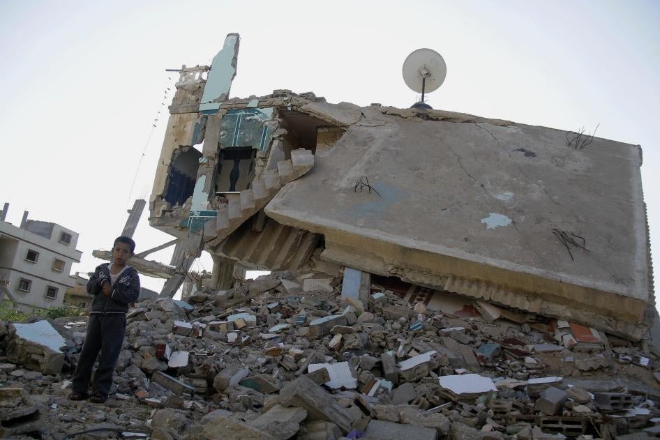 A boy stands on the debris of a building destroyed by the Egyptian army on the Egyptian side of the town of Rafah, Egypt, on November 6, 2014, near the start  of the conflict in northern Sinai. 