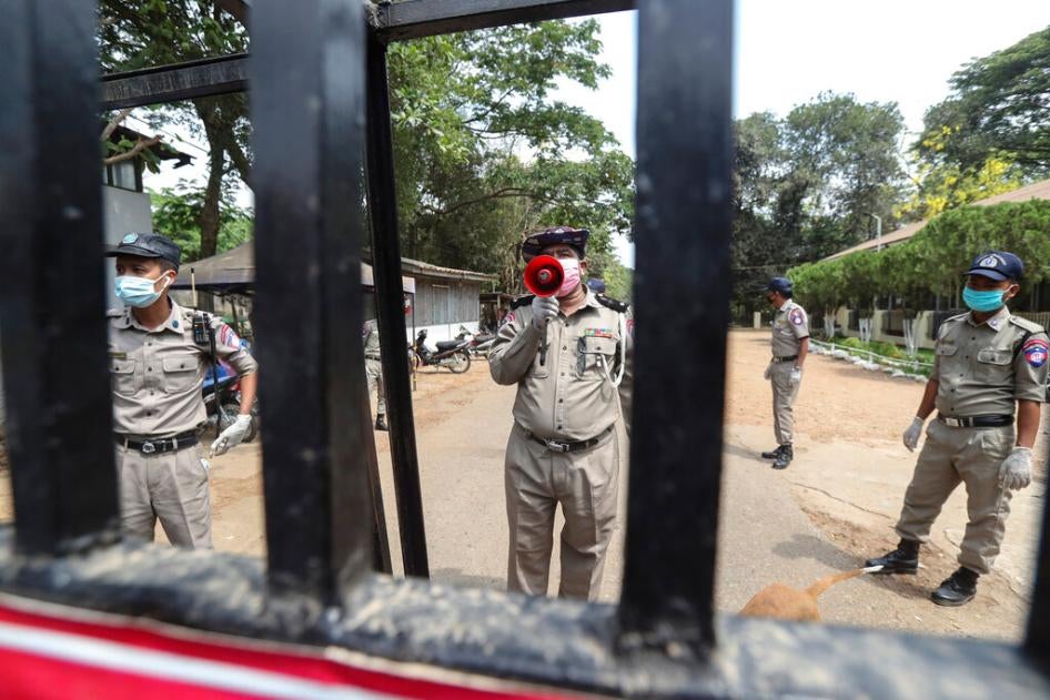 An official with a megaphone during the release of prisoners from Insein prison after a presidential pardon in Yangon