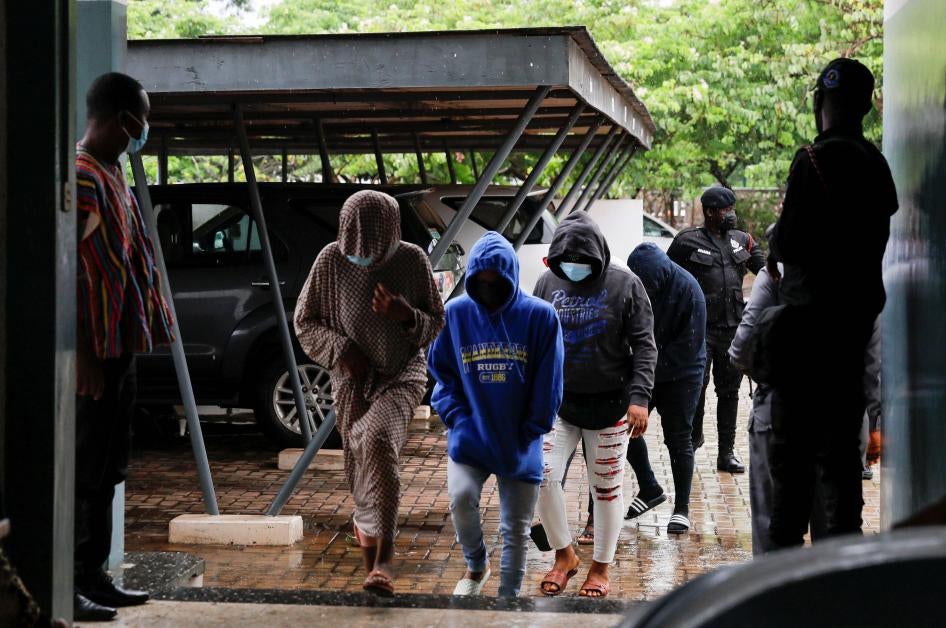 People who were detained by police on suspicion of promoting an LGBT agenda at an unlawful assembly arrive at a court for a bail hearing in Ho, Volta Region, Ghana on June 4, 2021.