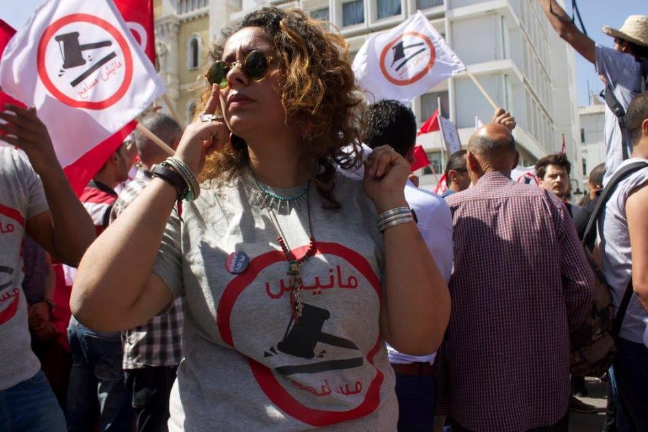 A woman in sunglasses at a protest