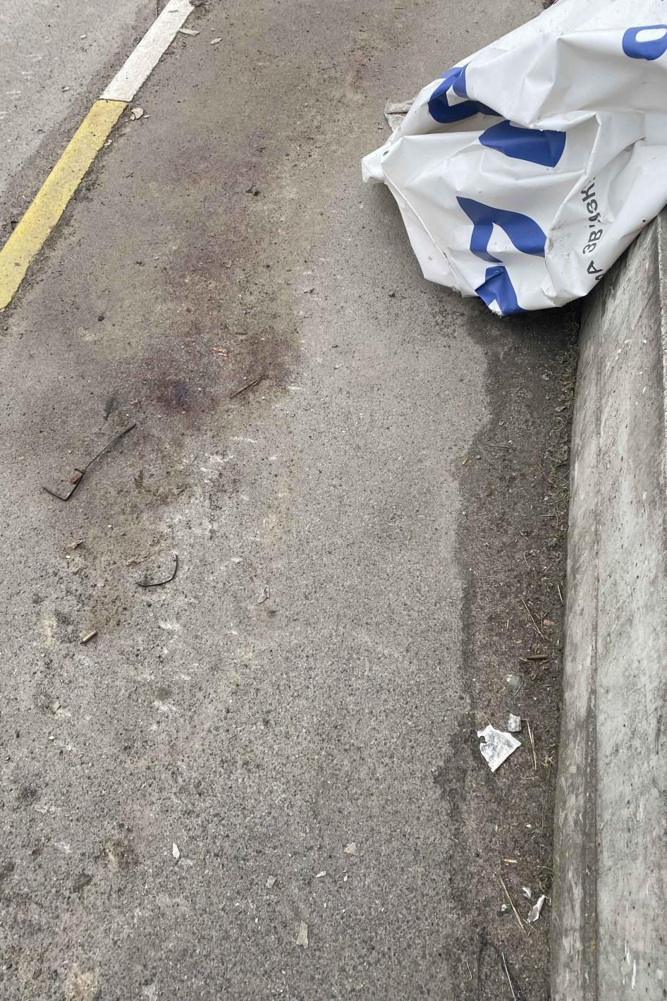 A large bloodstain on the corner of Yablunska and Vokzlana streets in Bucha