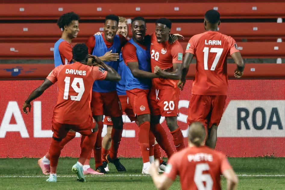 Soccer team celebrates after scoring a goal