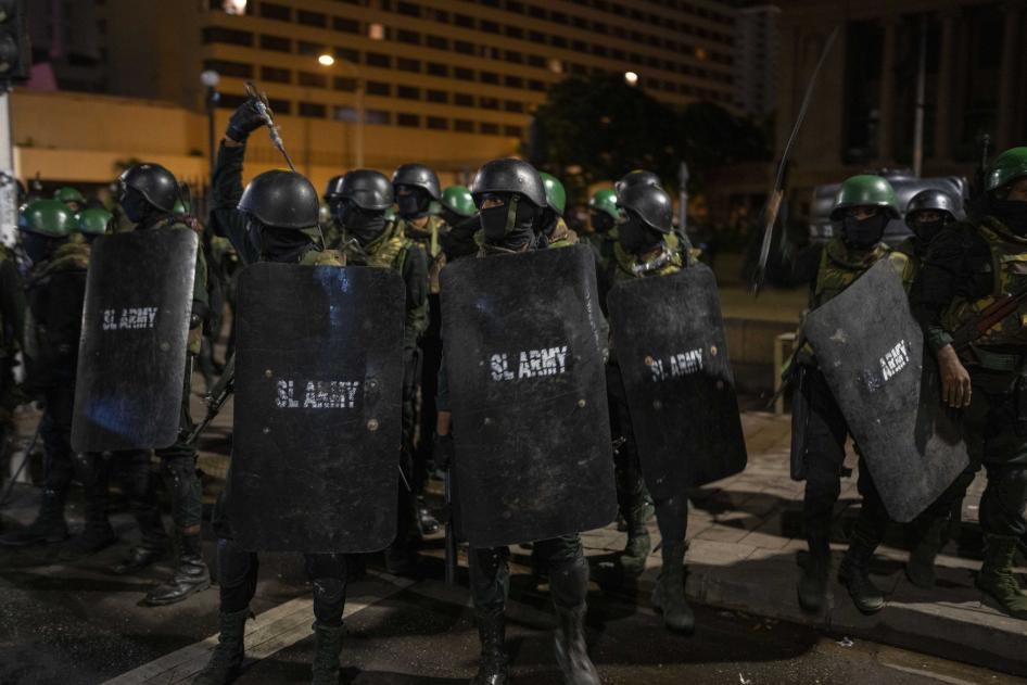 Sri Lankan army soldiers prepare to remove protesters and their tents from the site of a protest camp in Colombo, Sri Lanka, July 22, 2022.
