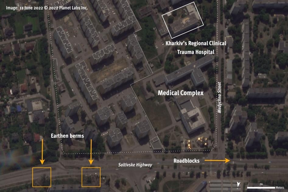 Satellite image recorded on June 11, 2022, two weeks before the attack on the Regional Clinical Trauma Hospital in Kharkiv city on June 26, shows roadblocks and earthen berms north of the medical complex.  