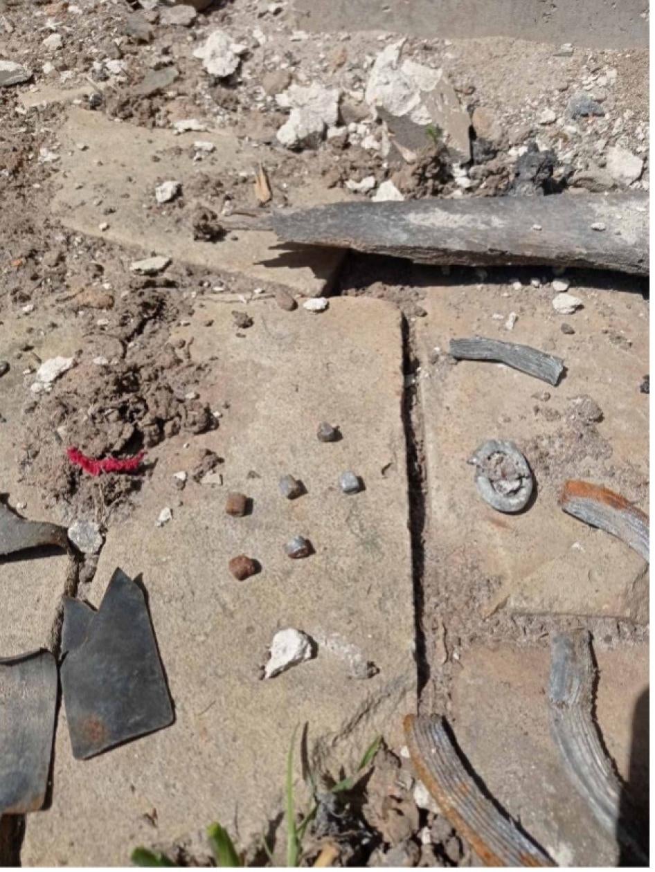 The gathered remnants of at least one rocket-delivered explosive submunition, which landed in the garden of Svitlana and Serhii Lukianenko in Derhachi on May 12, 2022, killing them, May 12, 2022. 
