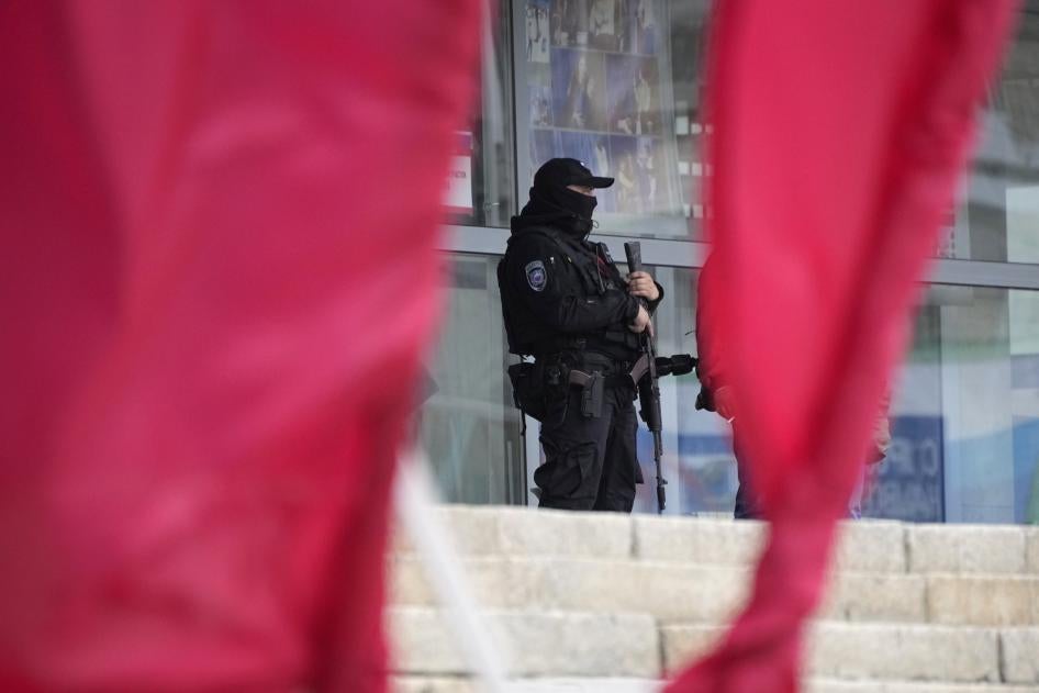 A Russian officer guards a polling station in the city of Luhansk, Ukraine, which is occupied by Russia.