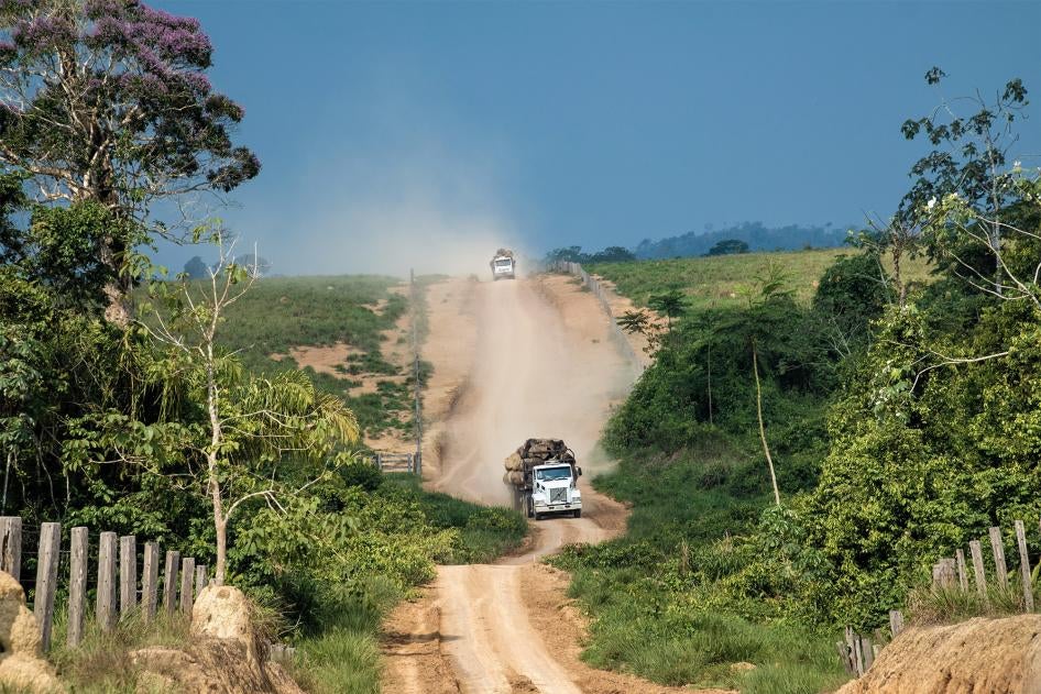 Trucks carrying illegally harvested logs exit the Terra Nossa settlement, September 30, 2019.