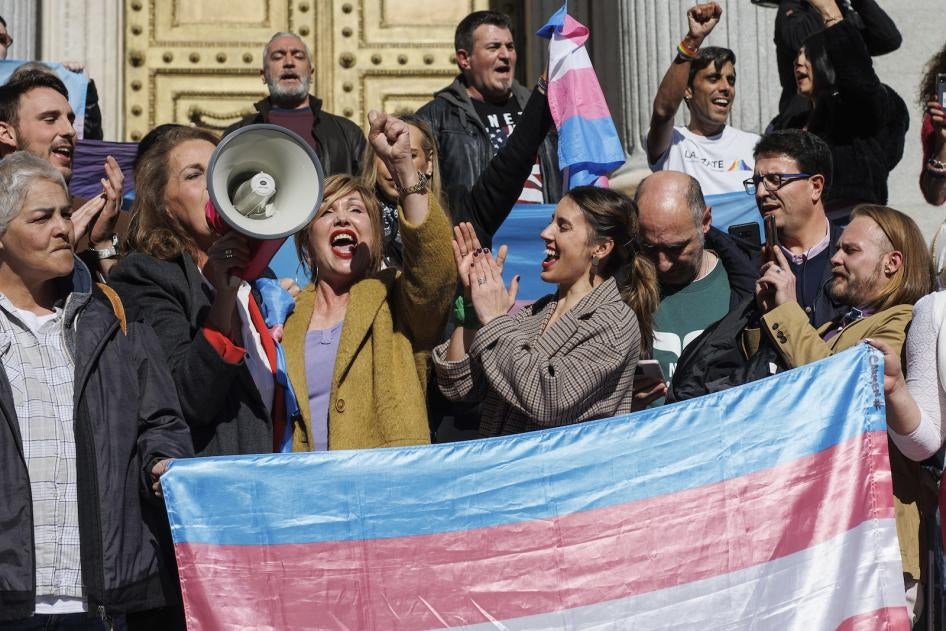 Spain’s Minister of Equality, Irene Montero, and LGBTI activists celebrate the passage of the “Trans Law” on the steps of the Congress of Deputies.