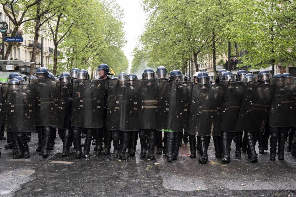 Riot police from the Gendarmerie Mobile advance in line as thousands of demonstrators take part in the traditional May Day demonstration, Paris, France.