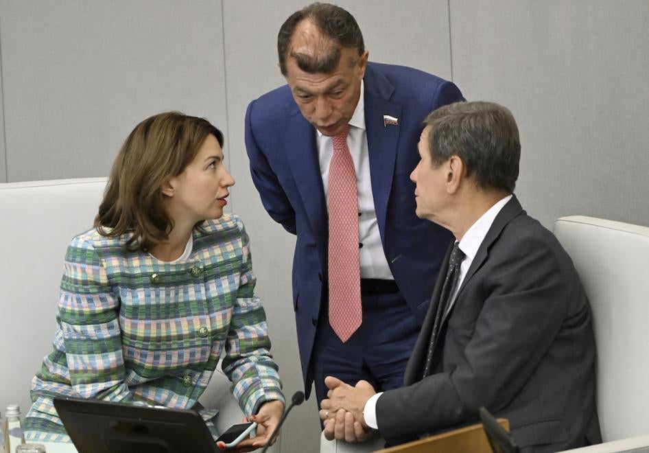 At a plenary session of Russia’s State Duma, First Deputy Chairman of the Russian State Duma Committee on State Building and Legislation Irina Pankina (left), confers with Chairman of the Russian State Duma Committee on Economic Policy Maxim Topilin (center) and First Deputy Chairman of the Russian State Duma Alexander Zhukov, Moscow, July 14, 2023. 