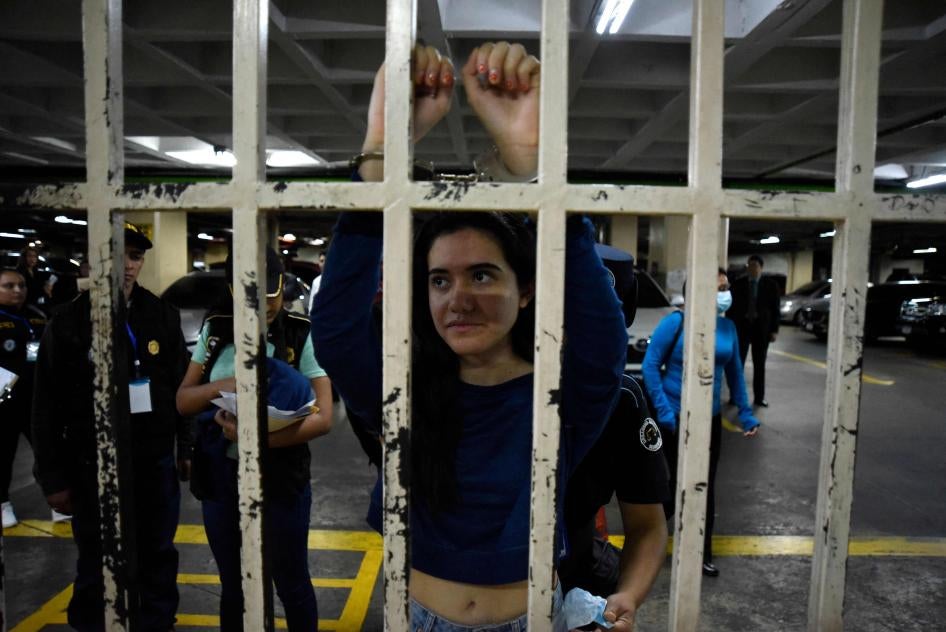 Marcela Blanco (C), a member of the Semilla Party, arrives handcuffed for a hearing at the Palace of Justice after being arrested at her home in Guatemala City on November 16, 2023.