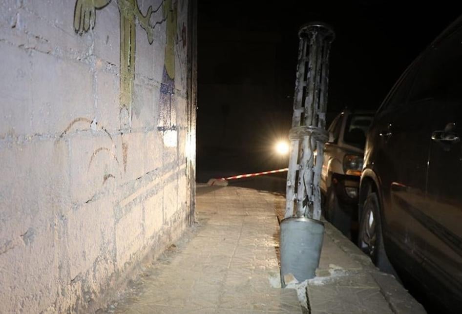 Remnant of an expended cargo section of one of the two 220mm 9M27K-series Uragan surface-launched cluster munition rockets embedded into the ground after it scattered its payload of explosive submunitions on a sidewalk next to a boys’ school in the town of Termanin, Syria 2023.