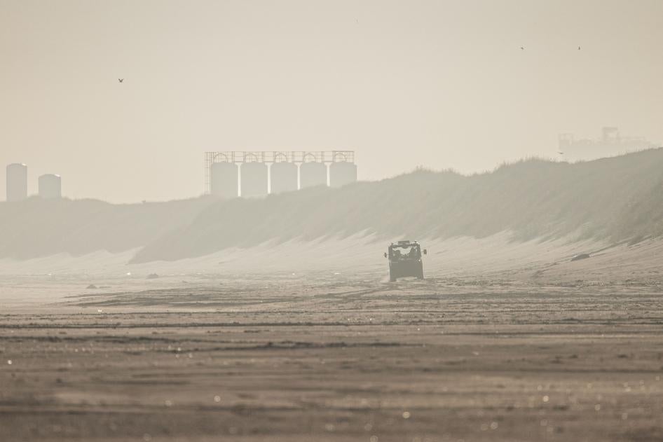 French National Police officers drive a buggy vehicle as they patrol the beach to prevent migrants or asylum seekers from boarding smugglers' boats on the beach of Gravelines, northern France, June 23, 2023.