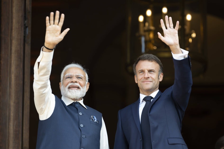 India's Prime Minister Narendra Modi (L) and France's President Emmanuel Macron attend a meeting at the Ministry of Foreign Affairs in Paris on July 14, 2023.