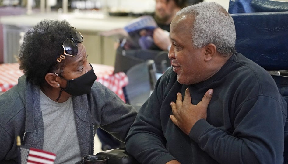 A couple speaks at the Mississippi State Veterans Home in Collins, Mississippi, April 1, 2021. 