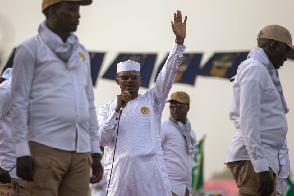 Deby waiving at the crowd